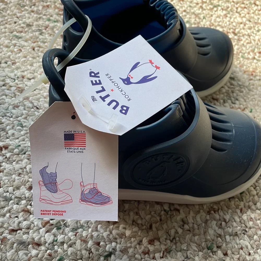 Brand new w/ tags slip on rain shoes in size 12 for kids.